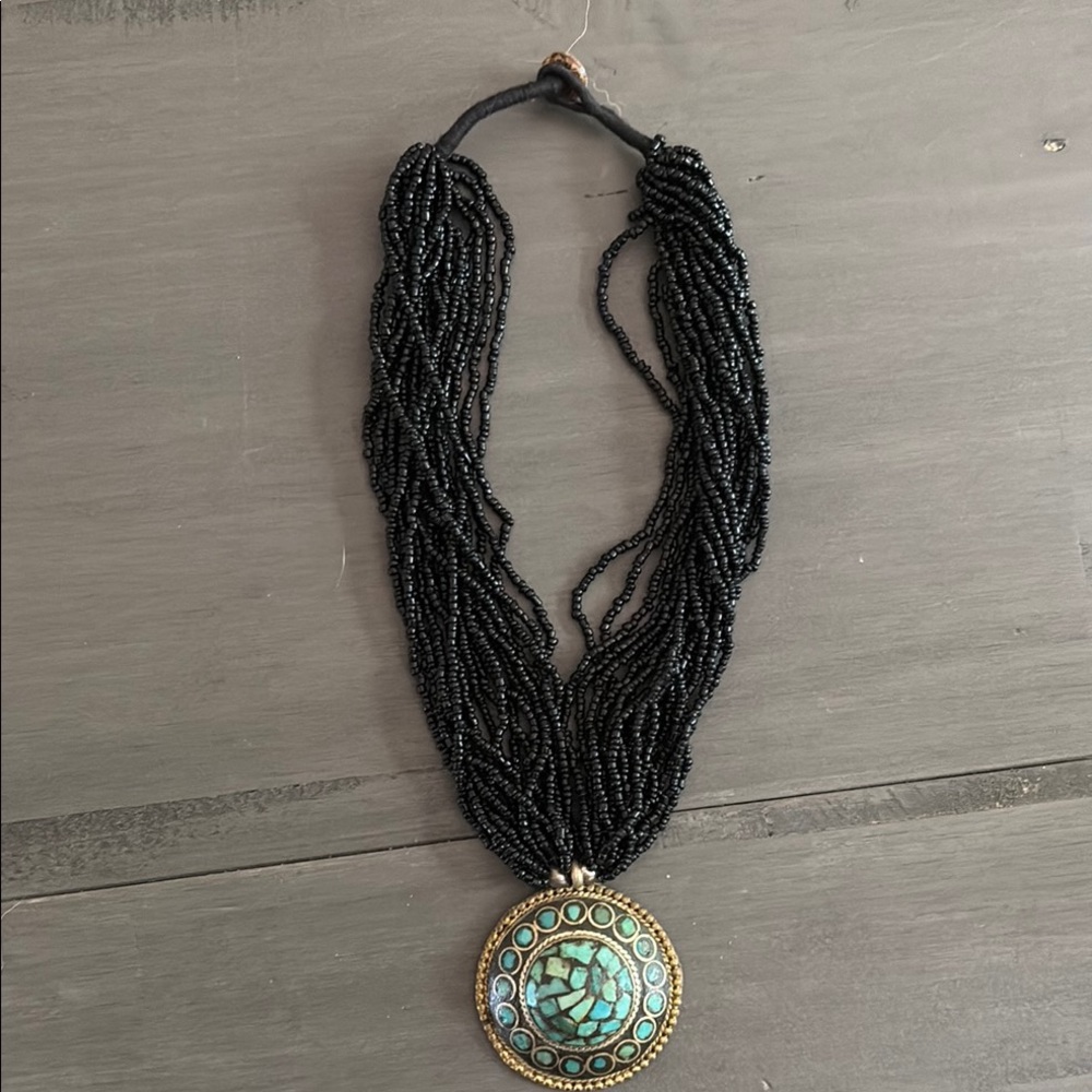 Black Beaded Necklace with Gold and Green Pendant
